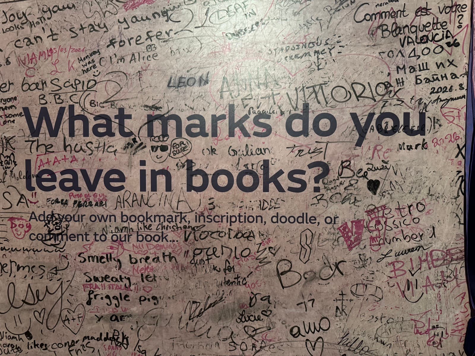Interactive wall asking what marks you leave in books